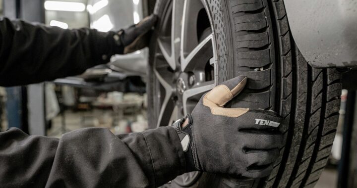a man working on a tire in a garage